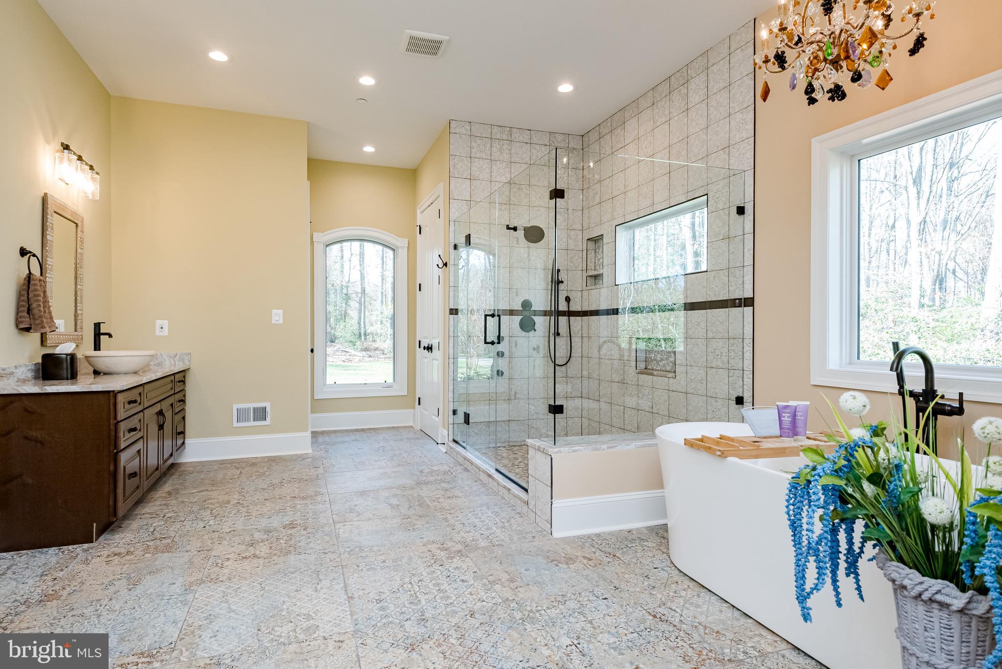 2033 Rosetta Way Davidsonville, MD 21035 - Photo 6 of 15 a spacious bathroom with a tub sink and mirror