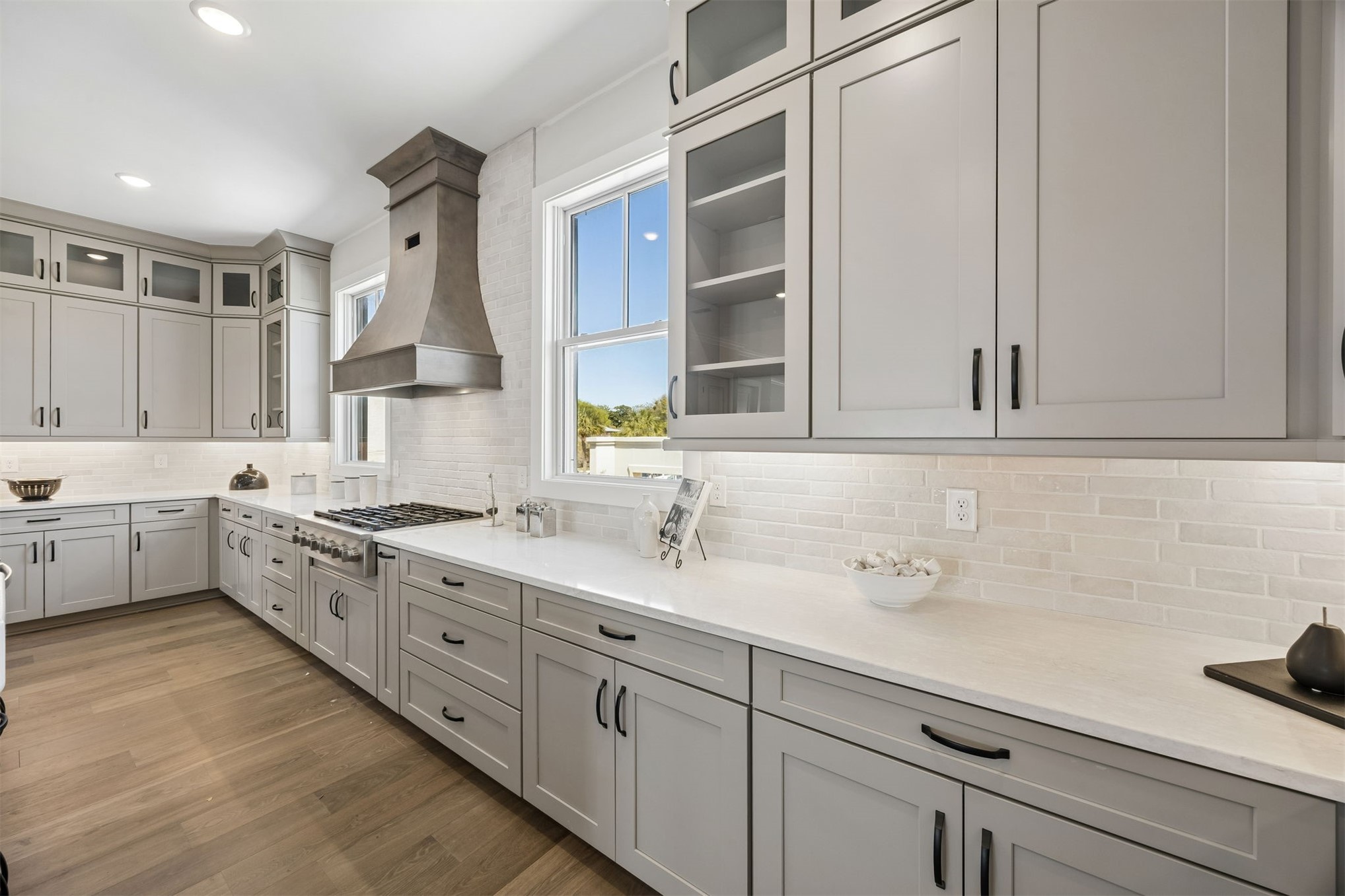 23 North 2nd Street Fernandina Beach, FL 32034 - Photo 22 of 74 a kitchen with white cabinets and white appliances