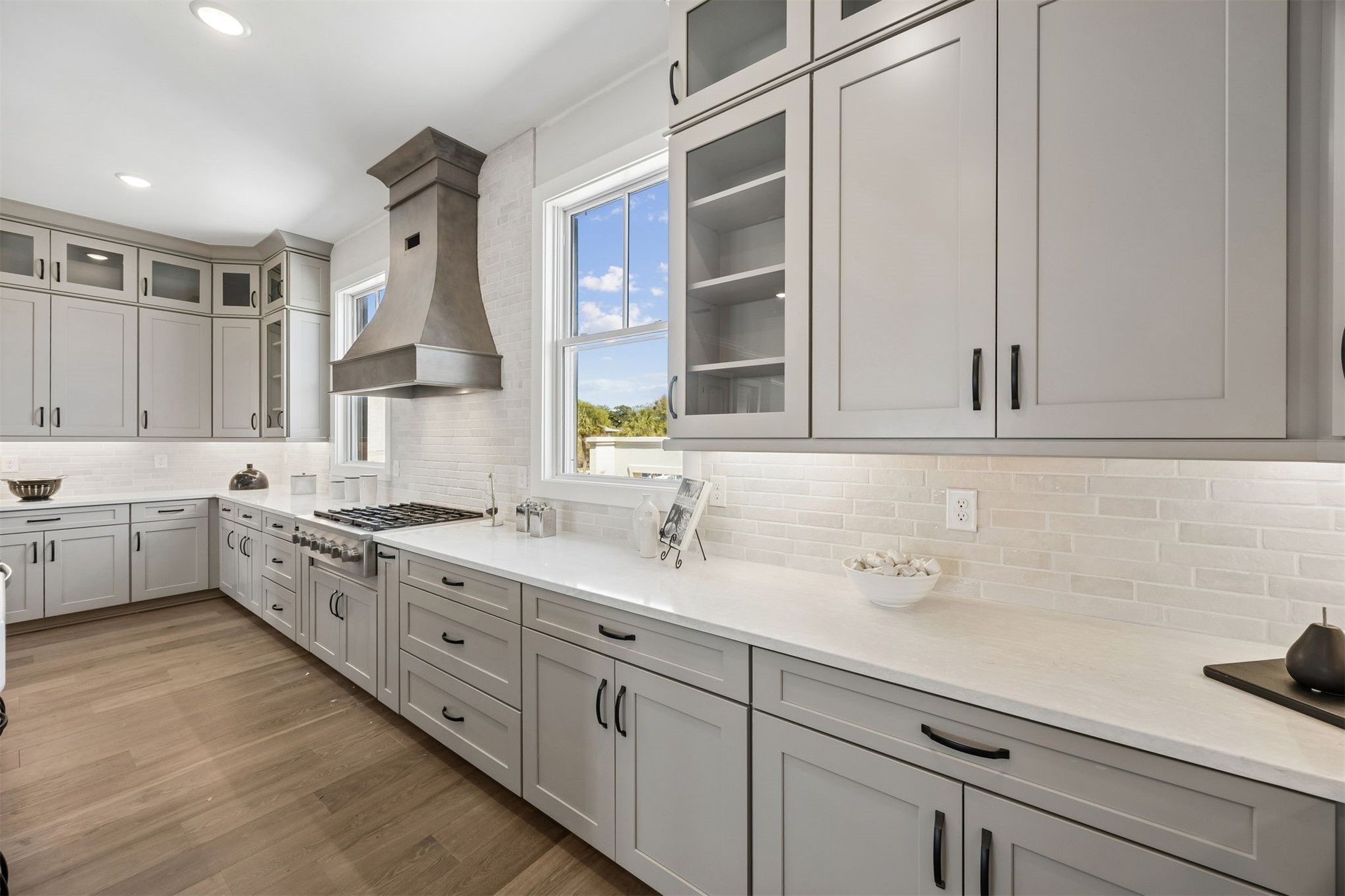 23 North 2nd Street Fernandina Beach, FL 32034 - Photo 23 of 74 a kitchen with white cabinets and white appliances