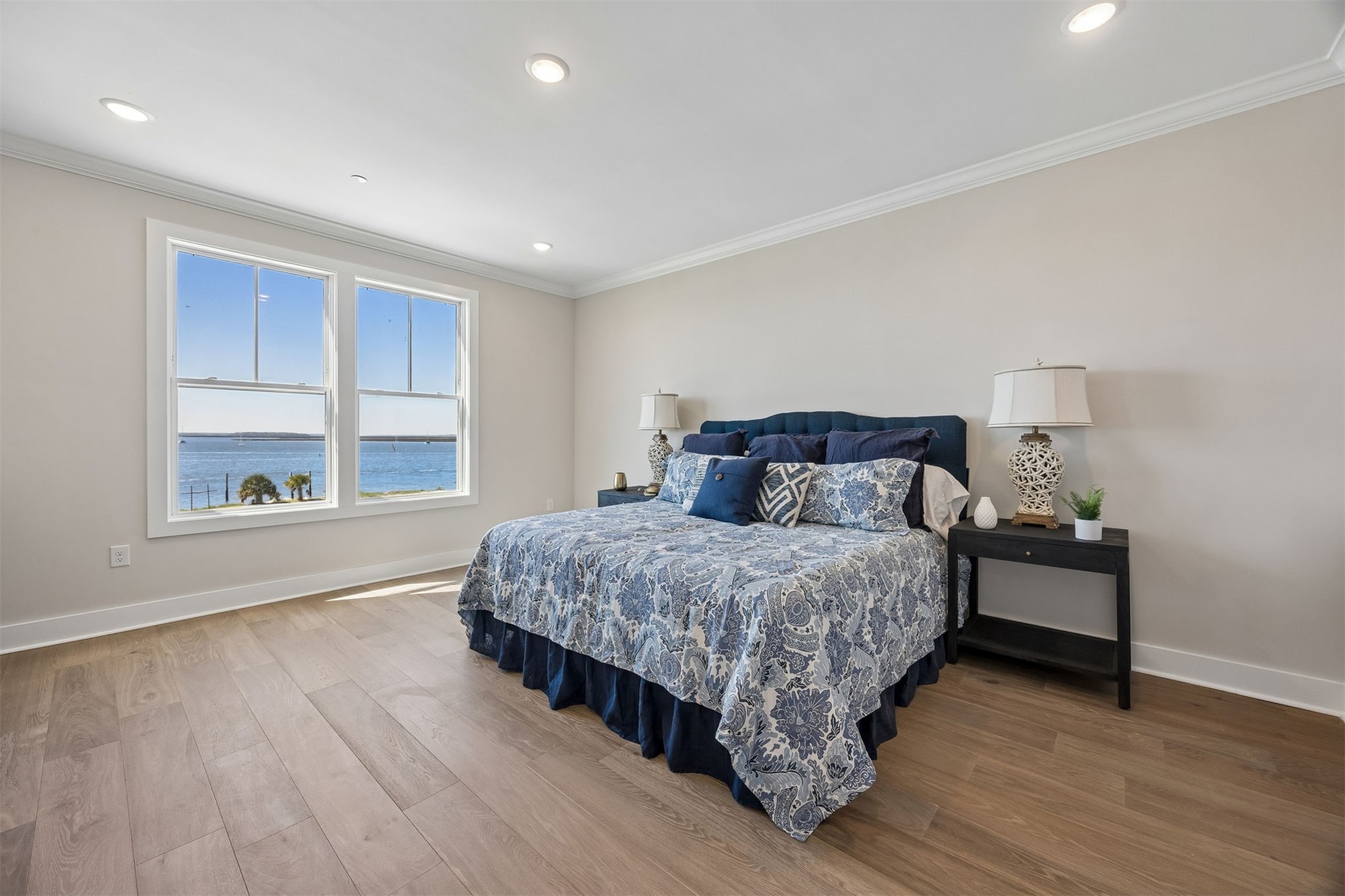 23 North 2nd Street Fernandina Beach, FL 32034 - Photo 32 of 74 a spacious bedroom with a bed and wooden floor