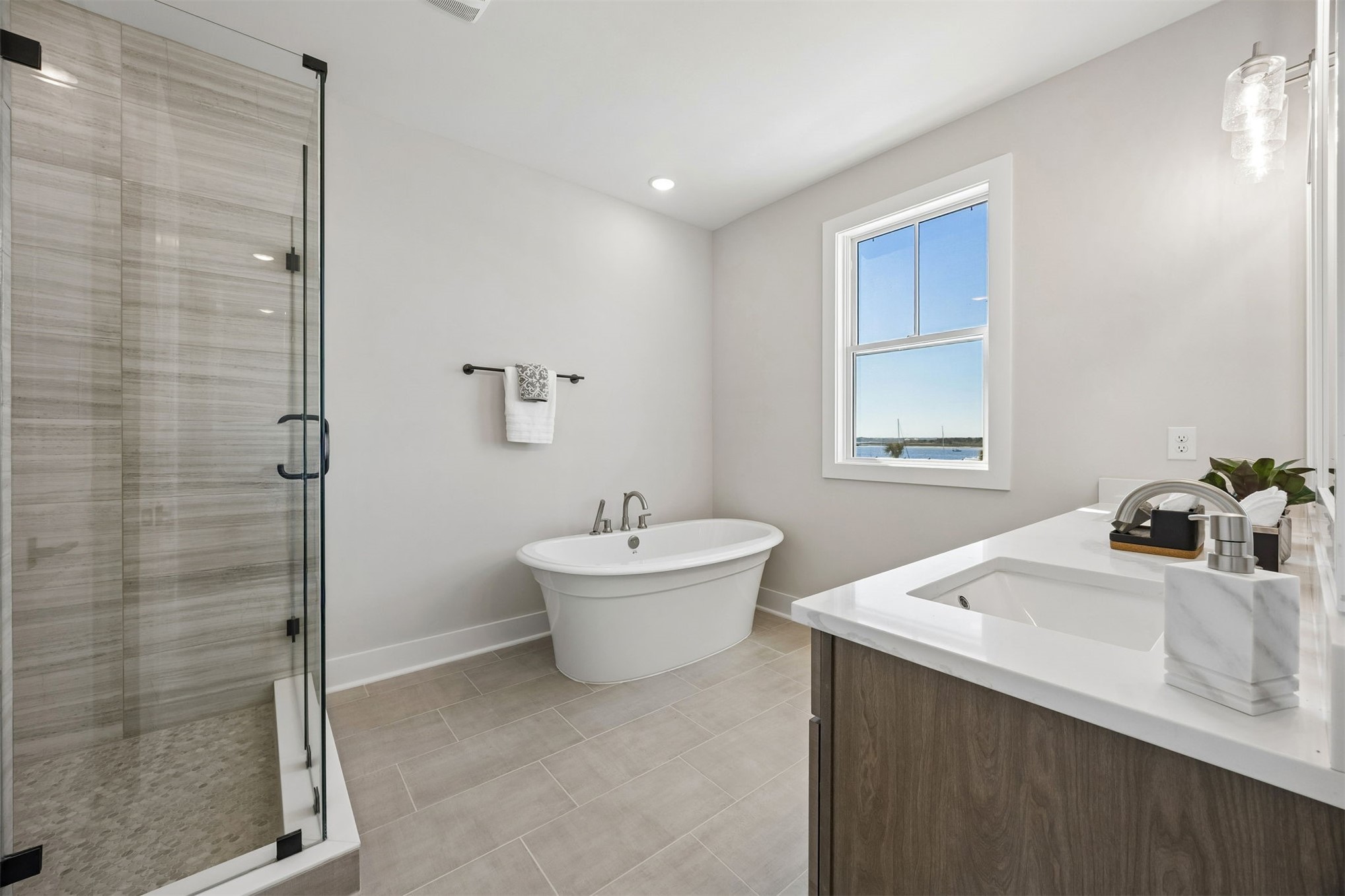 23 North 2nd Street Fernandina Beach, FL 32034 - Photo 36 of 74 a bathroom with a sink mirror and a bathtub