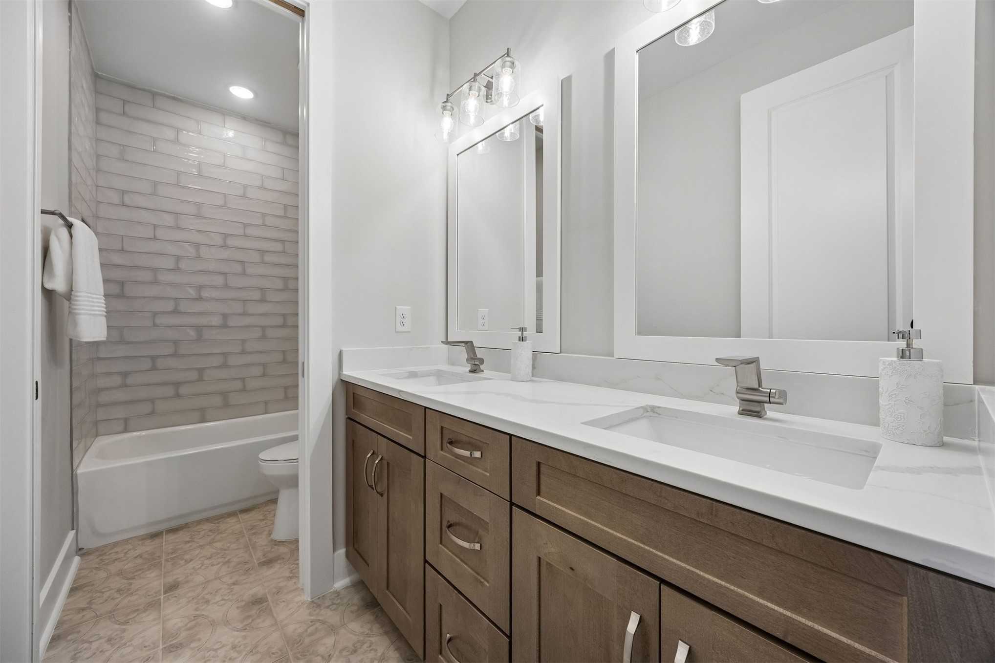 23 North 2nd Street Fernandina Beach, FL 32034 - Photo 50 of 74 a bathroom with a bathtub sink double vanity and mirror