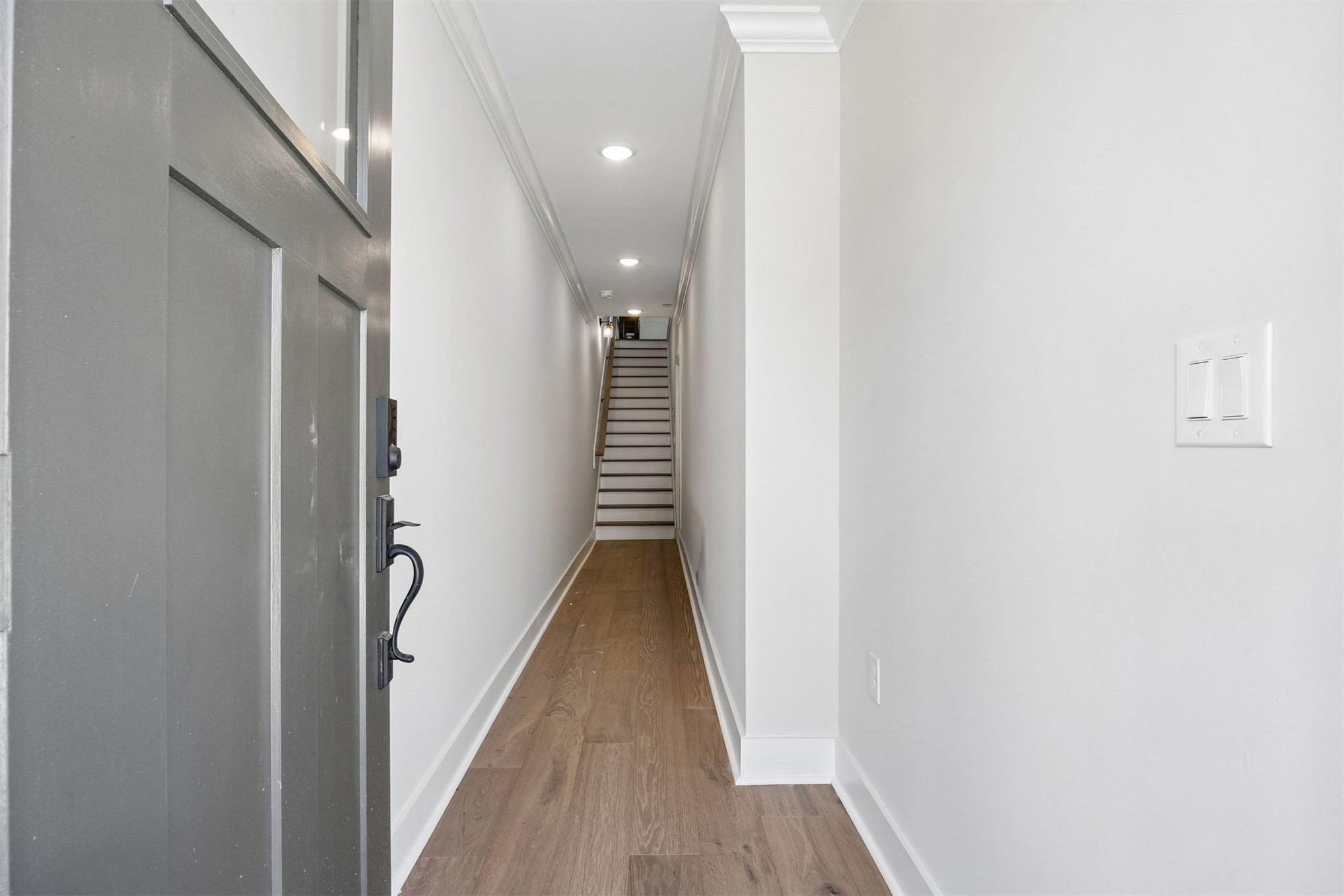 23 North 2nd Street Fernandina Beach, FL 32034 - Photo 6 of 74 a view of a hallway with wooden floor and staircase