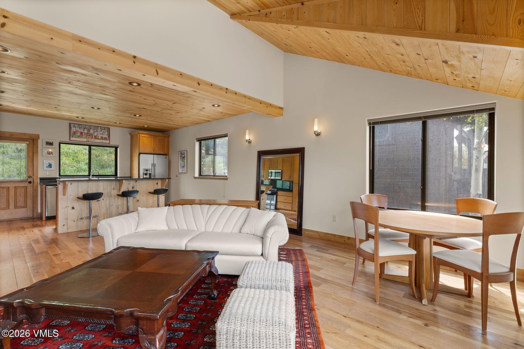 1015 West Wildwood Road, Unit F Avon, CO 81620 - Photo 5 of 35 a living room with furniture and a table