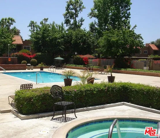 a view of a swimming pool with a patio