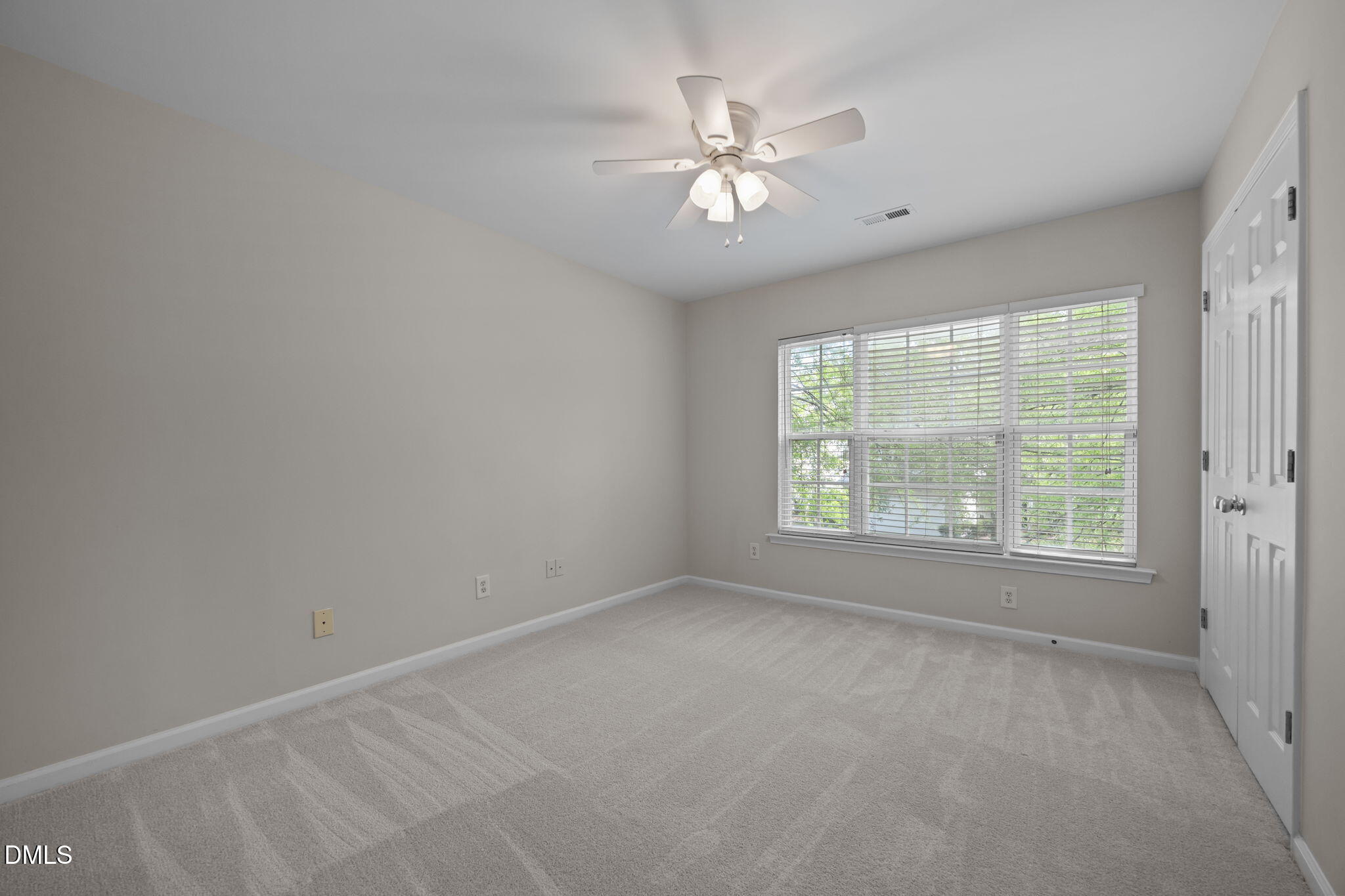 1003 Red Hat Lane Durham, NC 27713 - Photo 37 of 60 an empty room with chandelier fan and windows