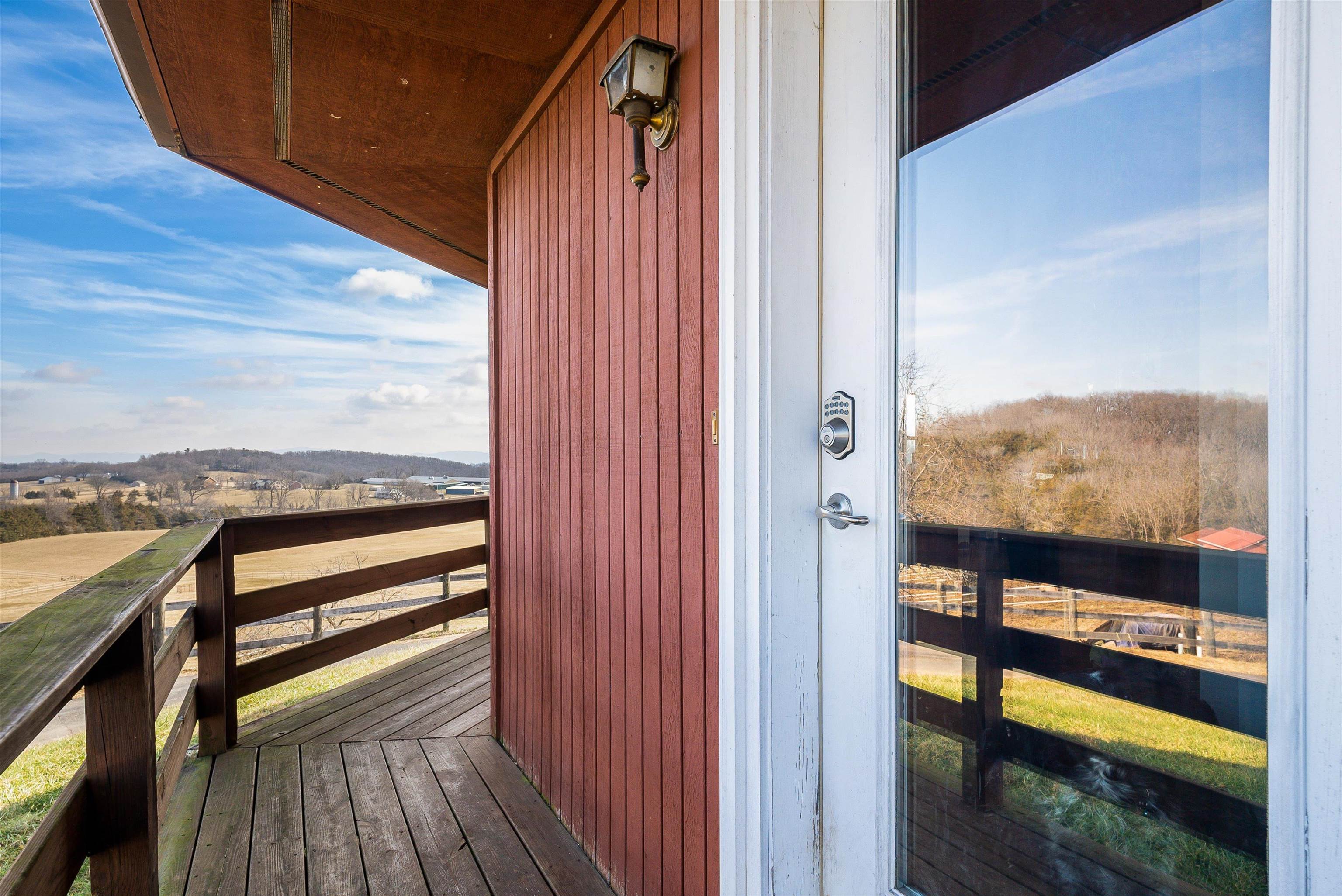 1103 Quick's Mill Road Staunton, VA 24401 - Photo 13 of 53 a view of a balcony with furniture and city view