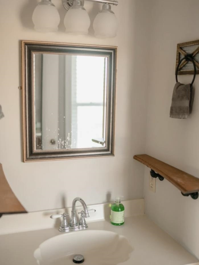 1103 Quick's Mill Road Staunton, VA 24401 - Photo 45 of 53 a bathroom with a sink and a window