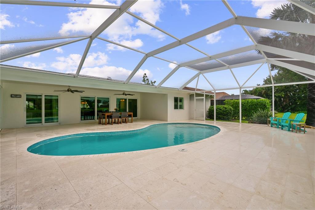 2218 Kings Lake Boulevard Naples, FL 34112 - Photo 11 of 50 a view of a house with backyard and porch