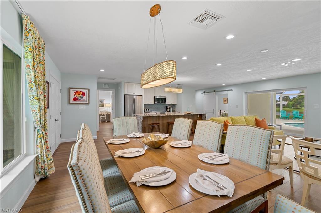 2218 Kings Lake Boulevard Naples, FL 34112 - Photo 12 of 50 a view of a dining room and livingroom