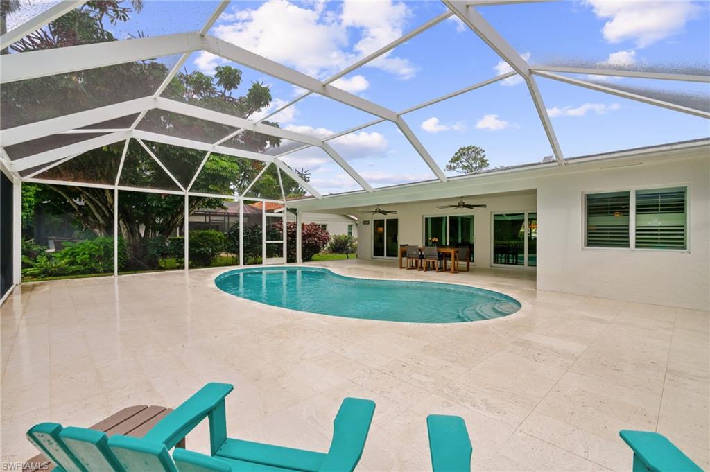 2218 Kings Lake Boulevard Naples, FL 34112 - Photo 21 of 50 a view of a house with backyard and porch