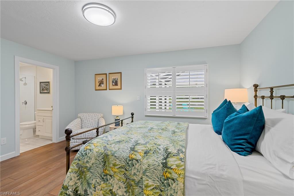 2218 Kings Lake Boulevard Naples, FL 34112 - Photo 28 of 50 a living room with furniture and a window