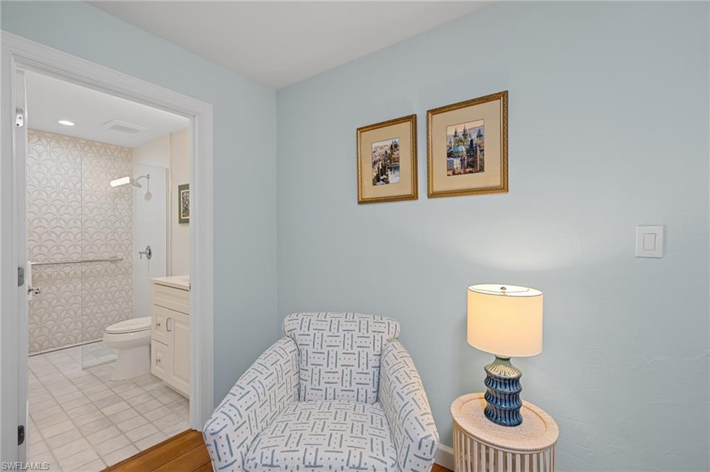 2218 Kings Lake Boulevard Naples, FL 34112 - Photo 31 of 50 a bathroom with a toilet sink vanity and window