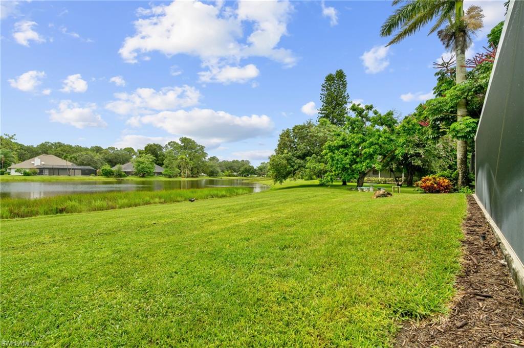 2218 Kings Lake Boulevard Naples, FL 34112 - Photo 35 of 50 a view of a golf course with a lake view