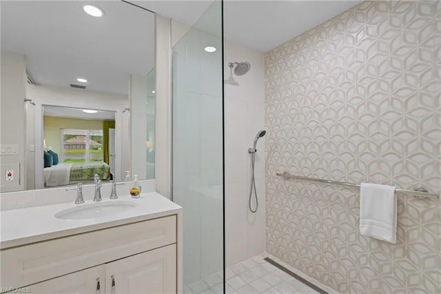 a bathroom with a sink toilet and mirror