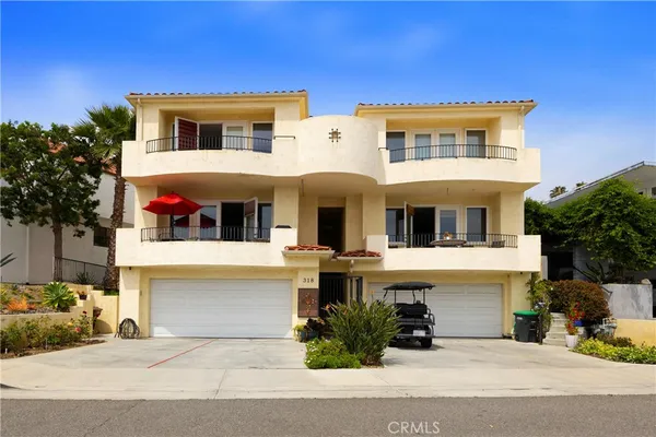 a front view of a house with yard