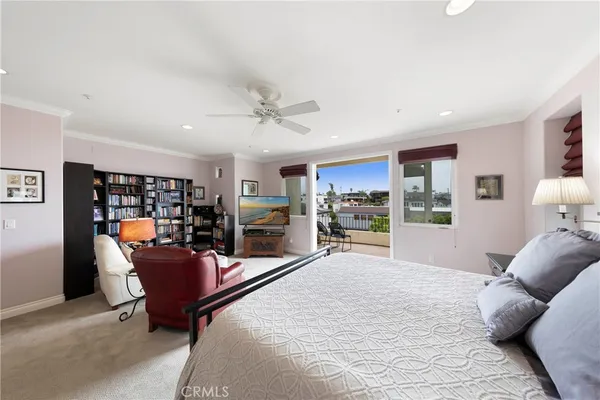 a living room with furniture and view of kitchen