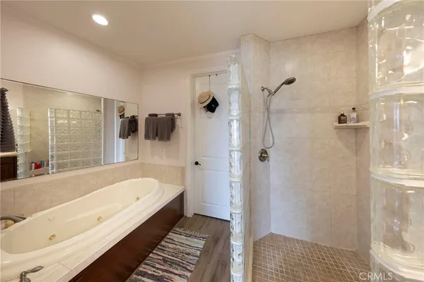 a bathroom with a bathtub and a shower