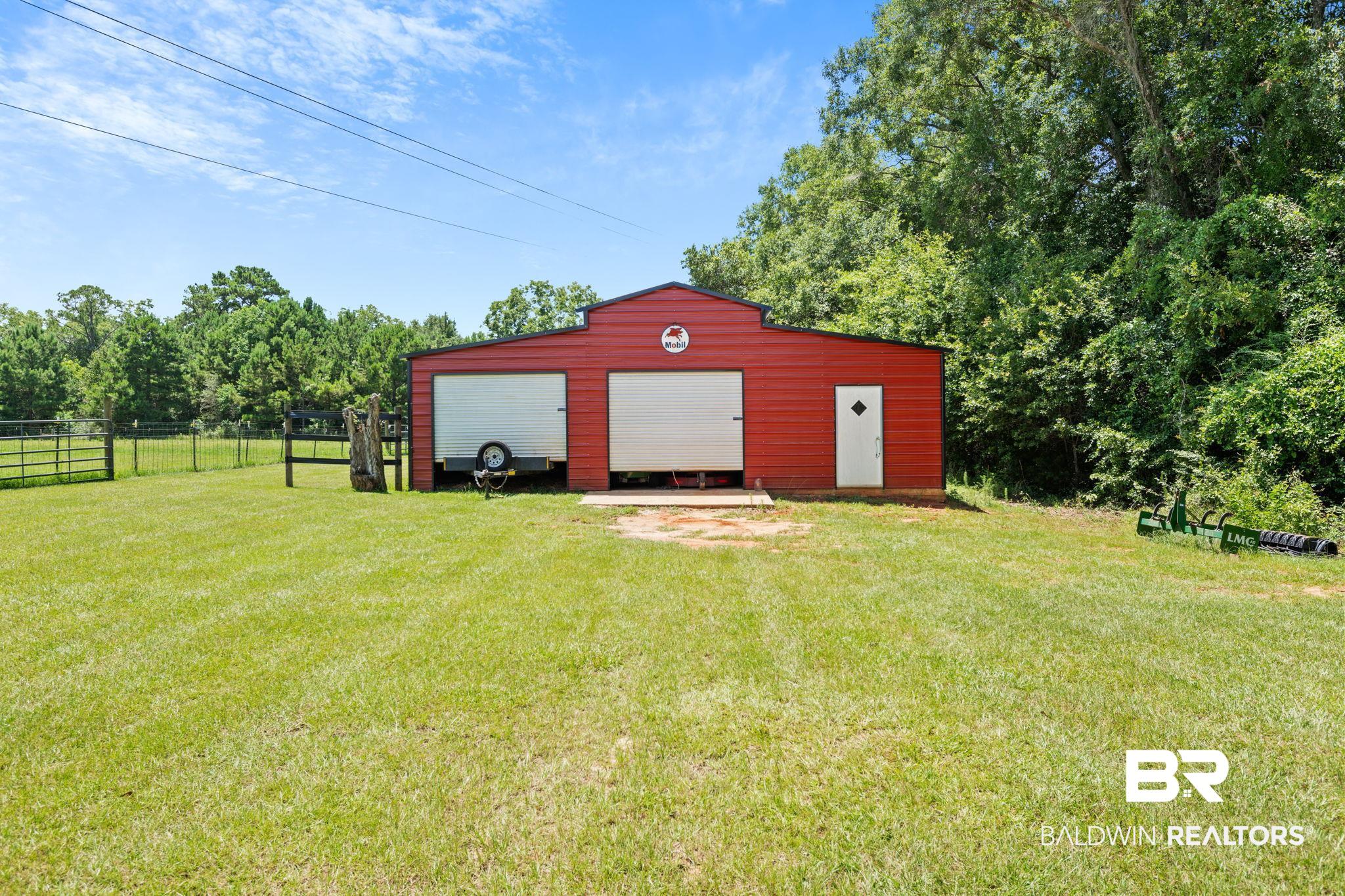 10703 South Ridge Drive Semmes, AL 36575 - Photo 4 of 37 View of outbuilding featuring driveway