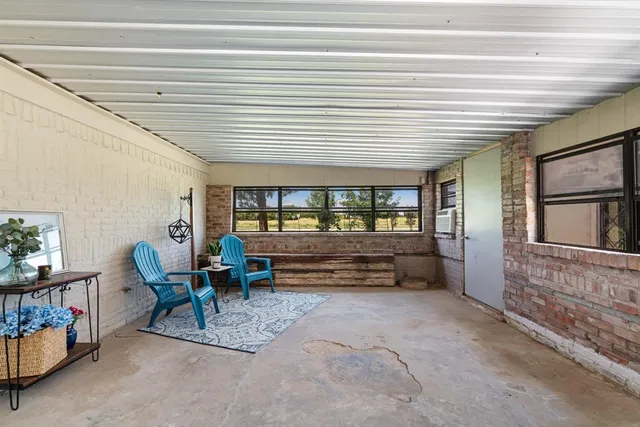 a reading room with furniture and a window