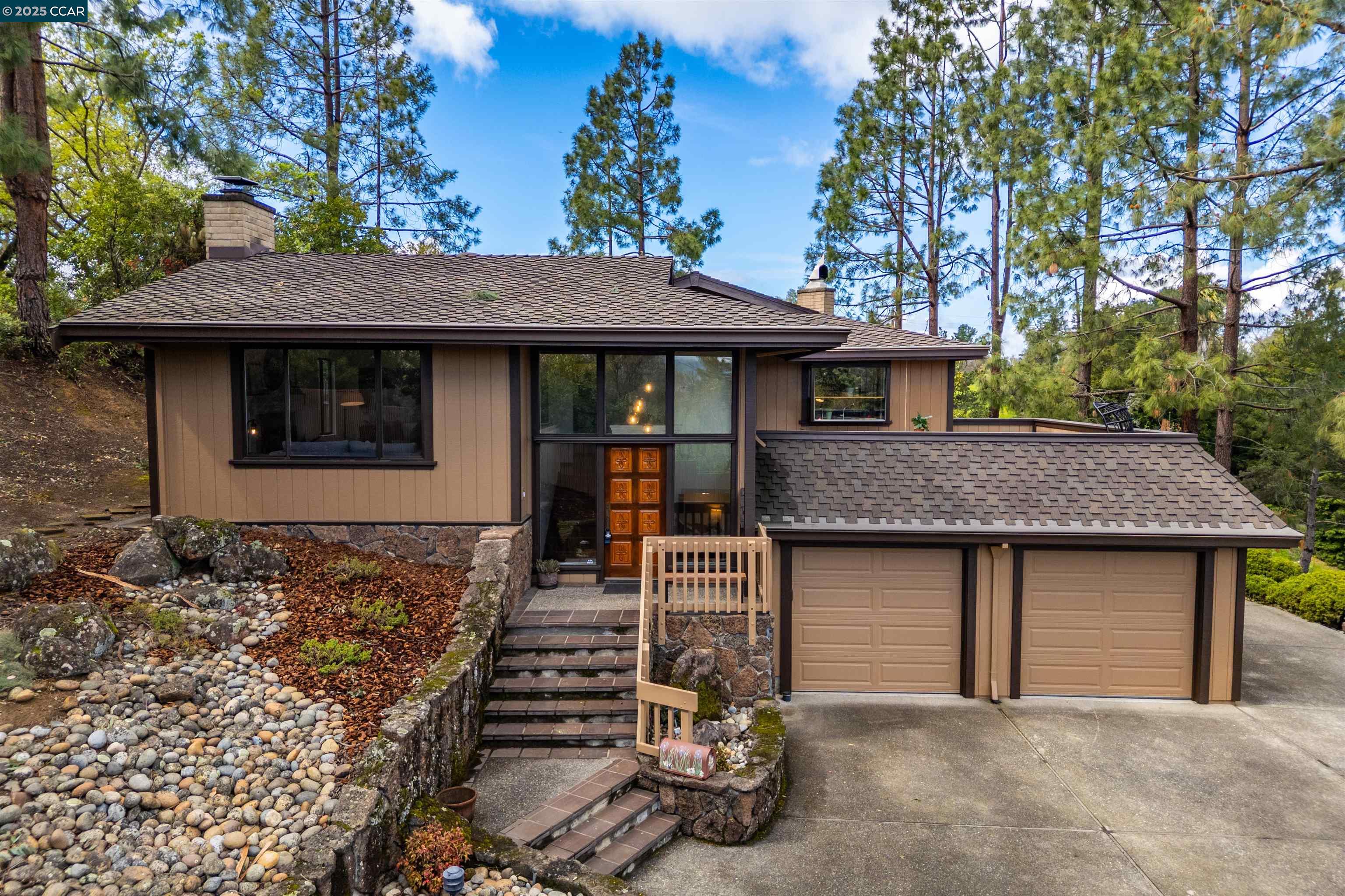 910 Ridge Drive Concord, CA 94518 - Photo 1 of 1 a front view of a house with garage