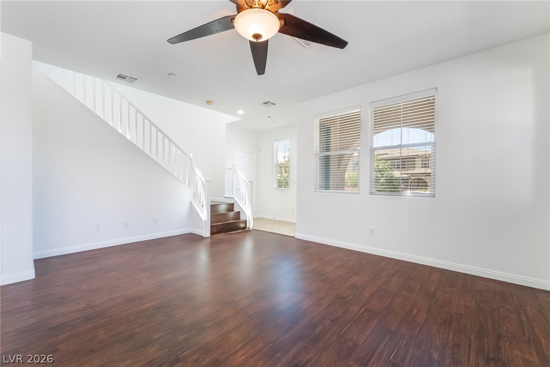 3175 Via Seranova Henderson, NV 89044 - Photo 9 of 45 This bright living space features rich hardwood flooring and a stylish ceiling fan.