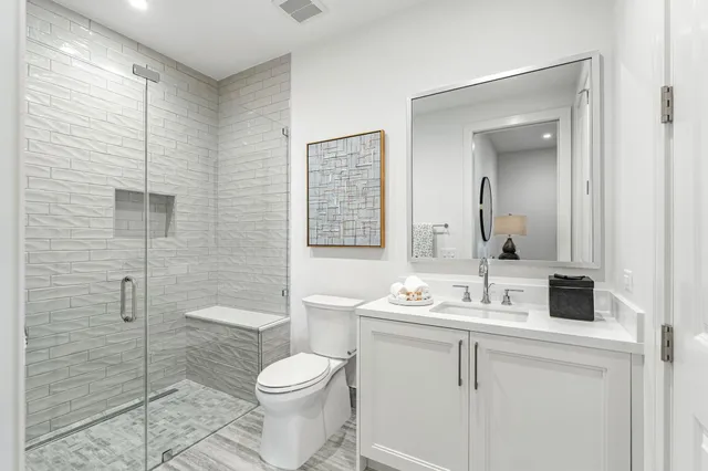 a living room with furniture and a mirror