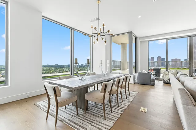 a living room with furniture and view of kitchen