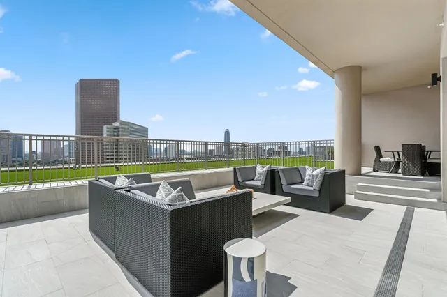 a view of kitchen with granite countertop cabinets and outdoor space