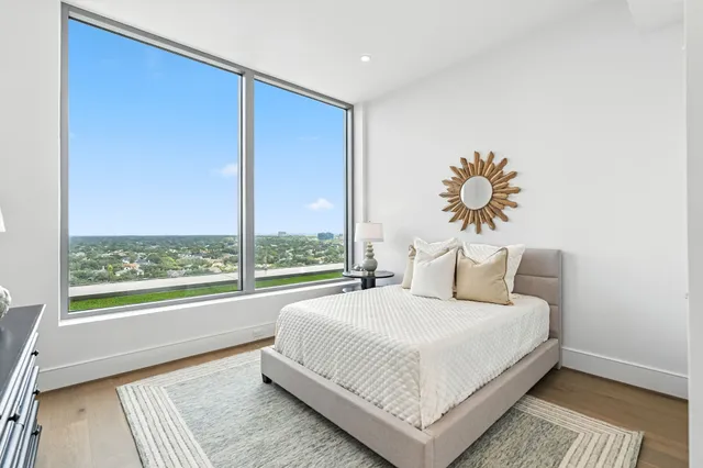 a bathroom with double sink and a mirror