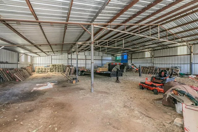 a view of a garage with parked cars