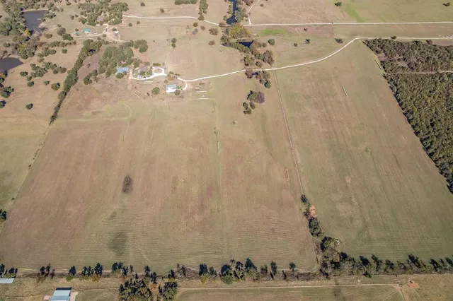 a view of a yard with an ocean view