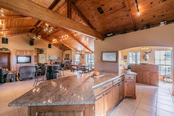 a kitchen with stainless steel appliances granite countertop sink stove and cabinets