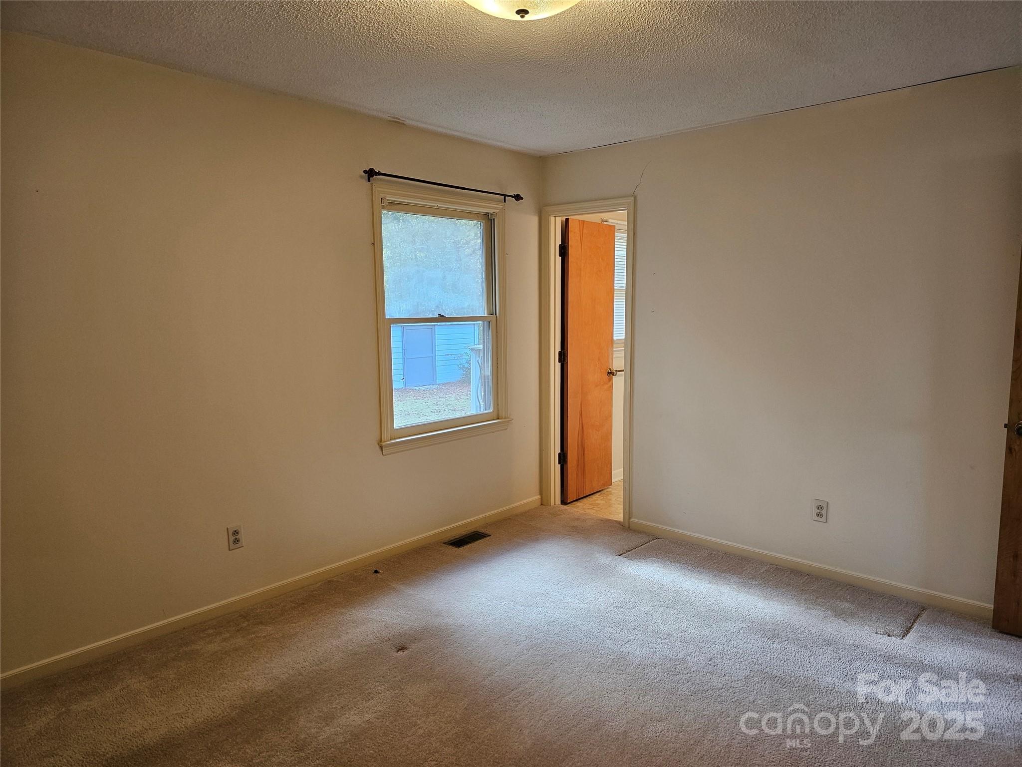 2486 Oxford Circle Lancaster, SC 29720 - Photo 14 of 17 an empty room with windows