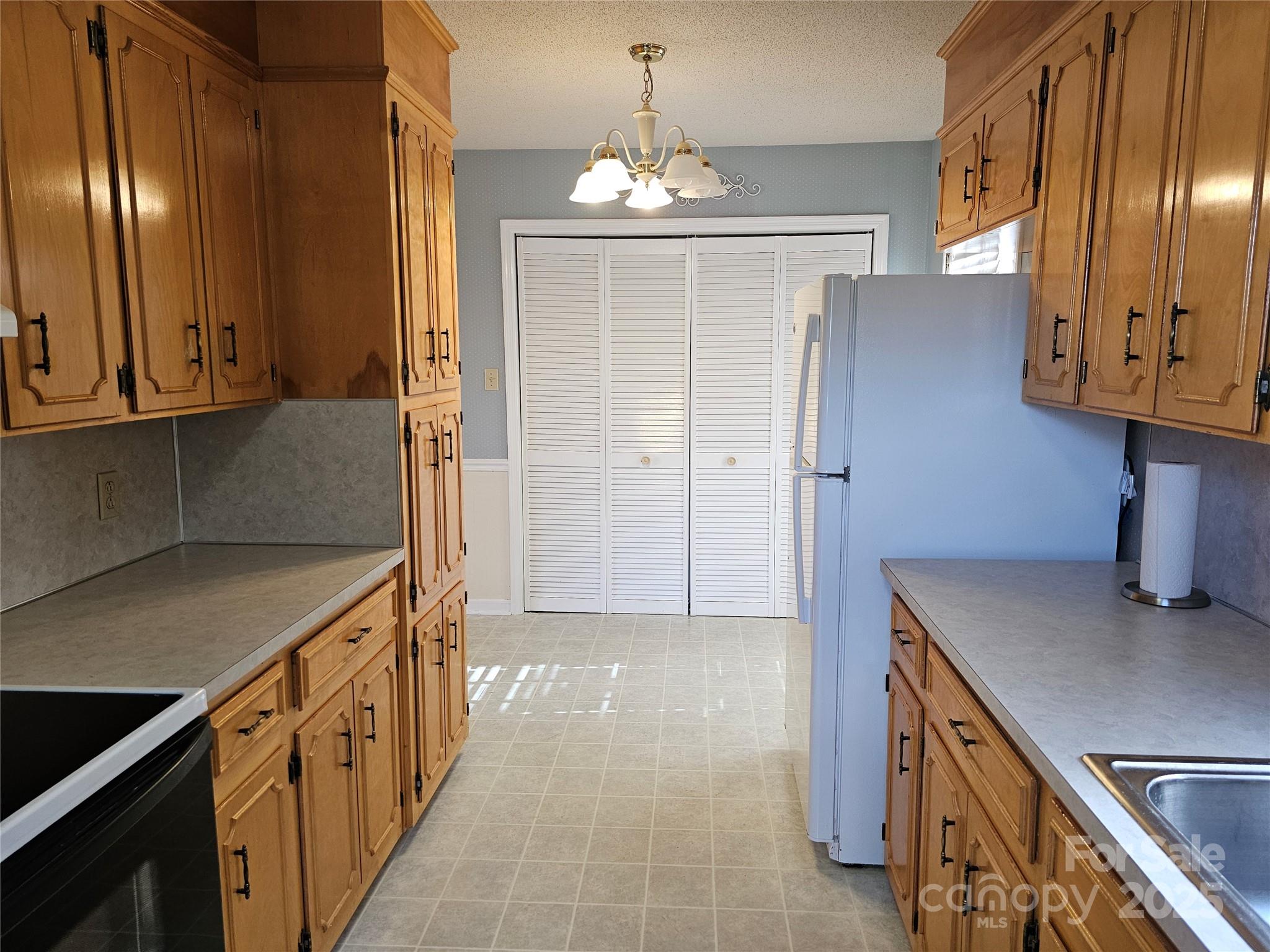 2486 Oxford Circle Lancaster, SC 29720 - Photo 8 of 17 a kitchen with granite countertop a sink cabinets and stainless steel appliances