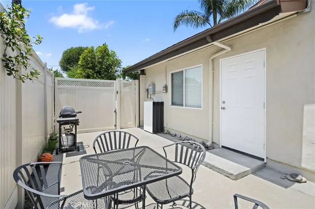 a balcony view with a seating space