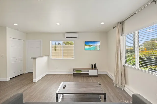 a view of kitchen with furniture wooden floor and windows