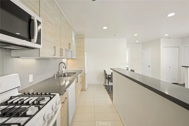 a kitchen with a stove and a microwave