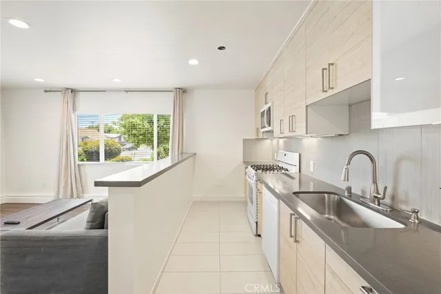 a kitchen with a sink and a window
