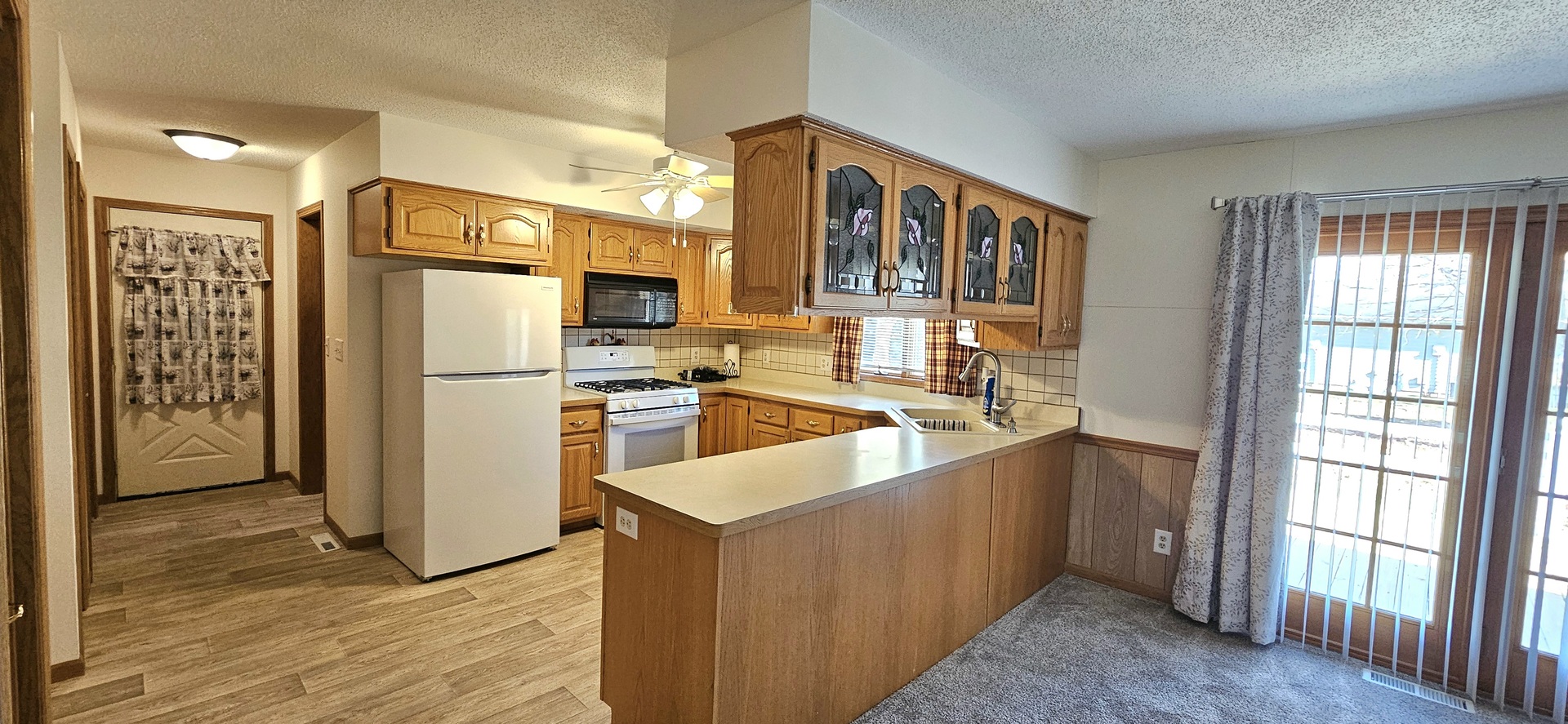 507 South 9th Street Princeton, IL 61356 - Photo 4 of 7 a kitchen with stainless steel appliances granite countertop a refrigerator and a sink