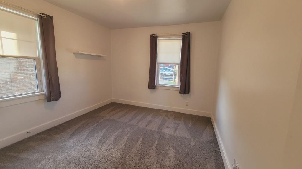 2907 Main Street Homestead, PA 15120 - Photo 11 of 14 an empty room with windows