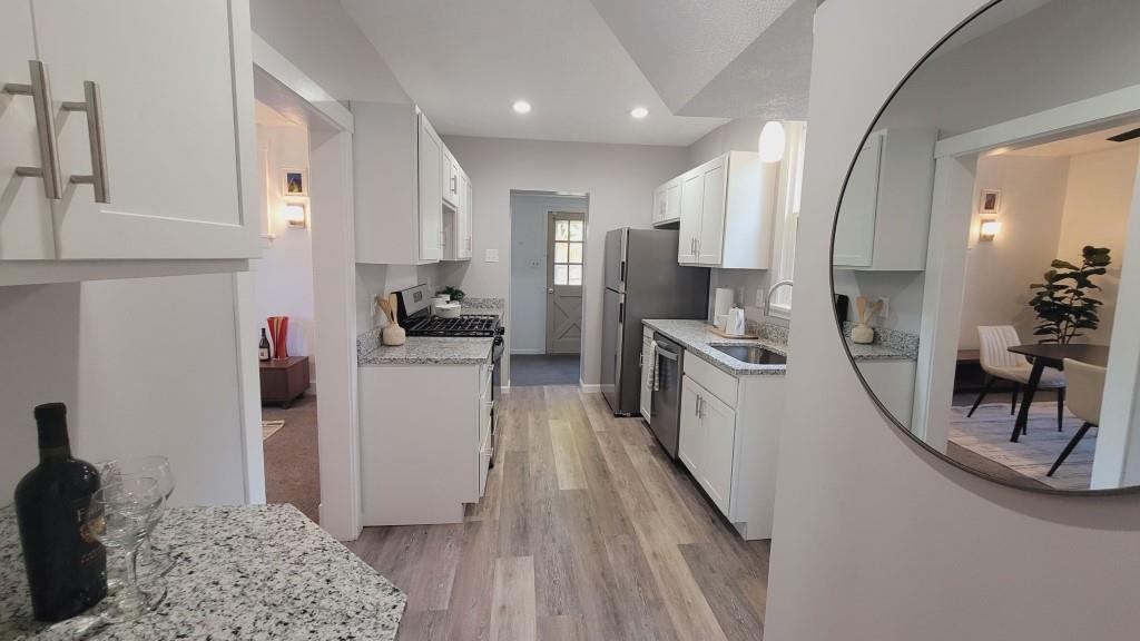 2907 Main Street Homestead, PA 15120 - Photo 4 of 14 a kitchen with stainless steel appliances granite countertop a refrigerator and a stove