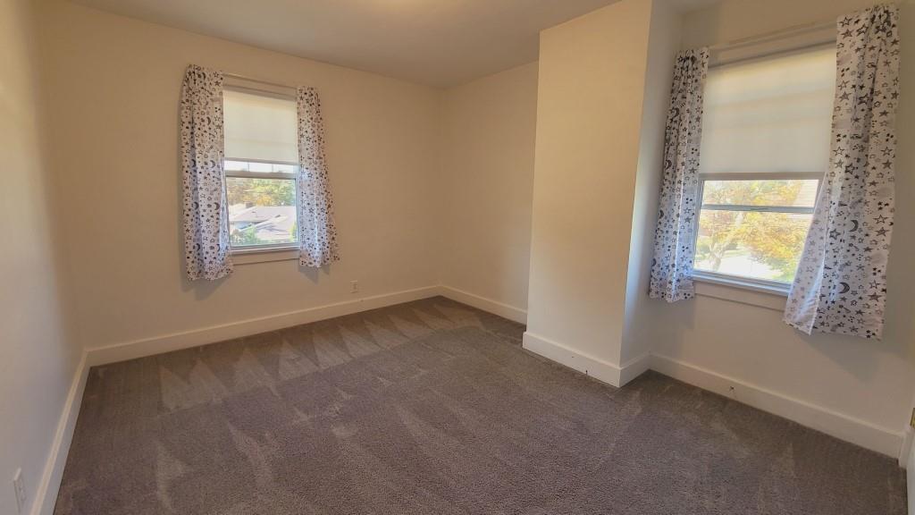 2907 Main Street Homestead, PA 15120 - Photo 10 of 14 an empty room with windows and closet