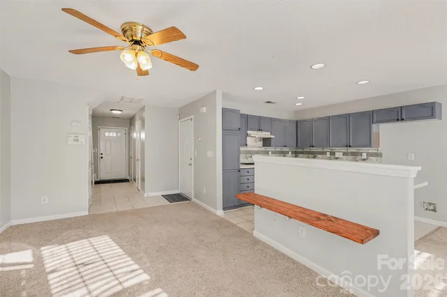 a view of a kitchen with a sink and dishwasher