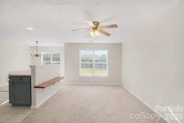 a view of workspace with furniture and window