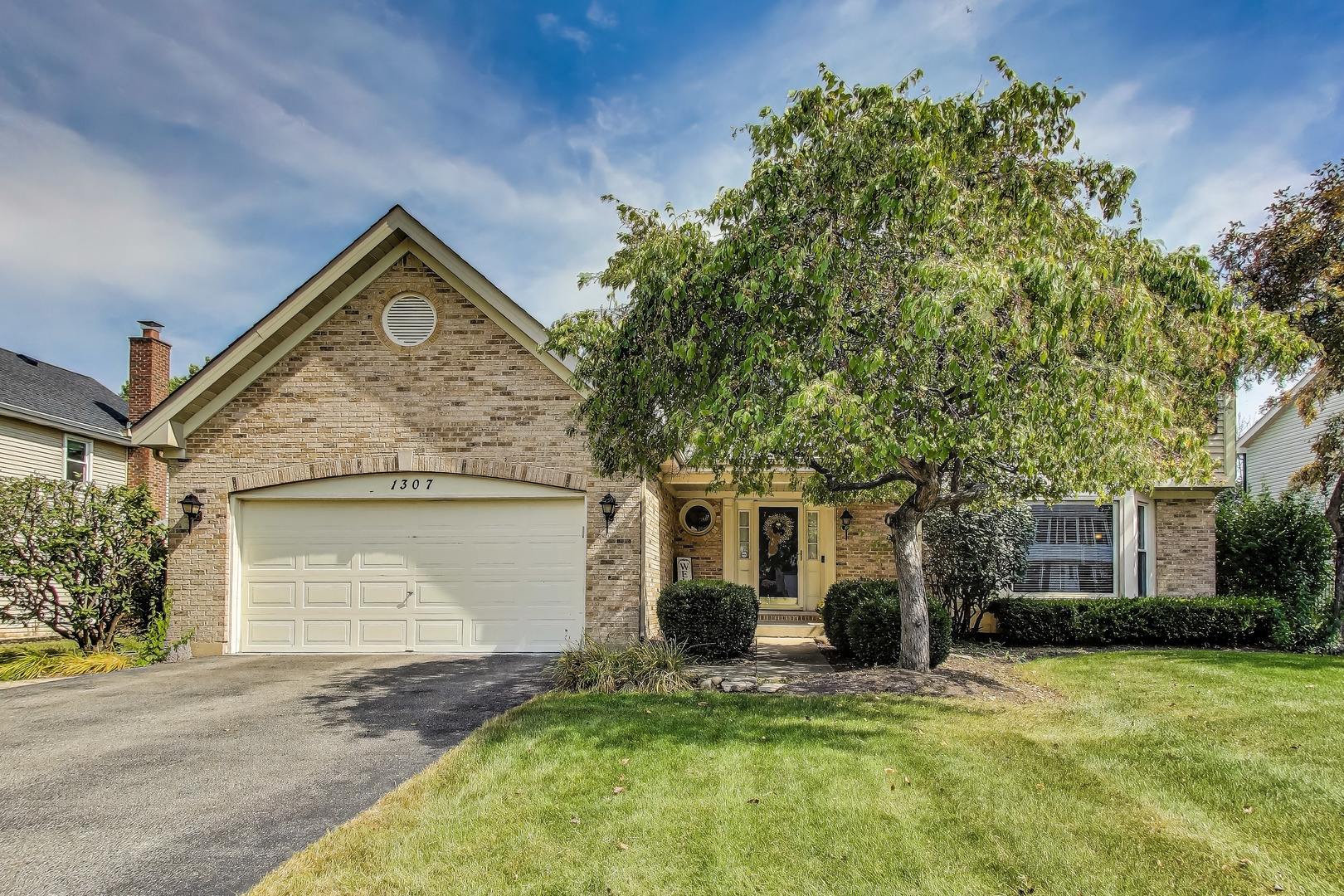 1307 Saddlebrook Road Bartlett, IL 60103 - Photo 1 of 1 a front view of a house with a yard