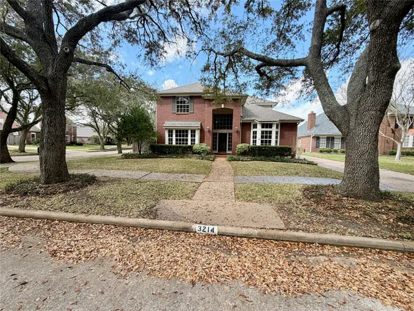 a view of a hallway view with wooden floor and staircase