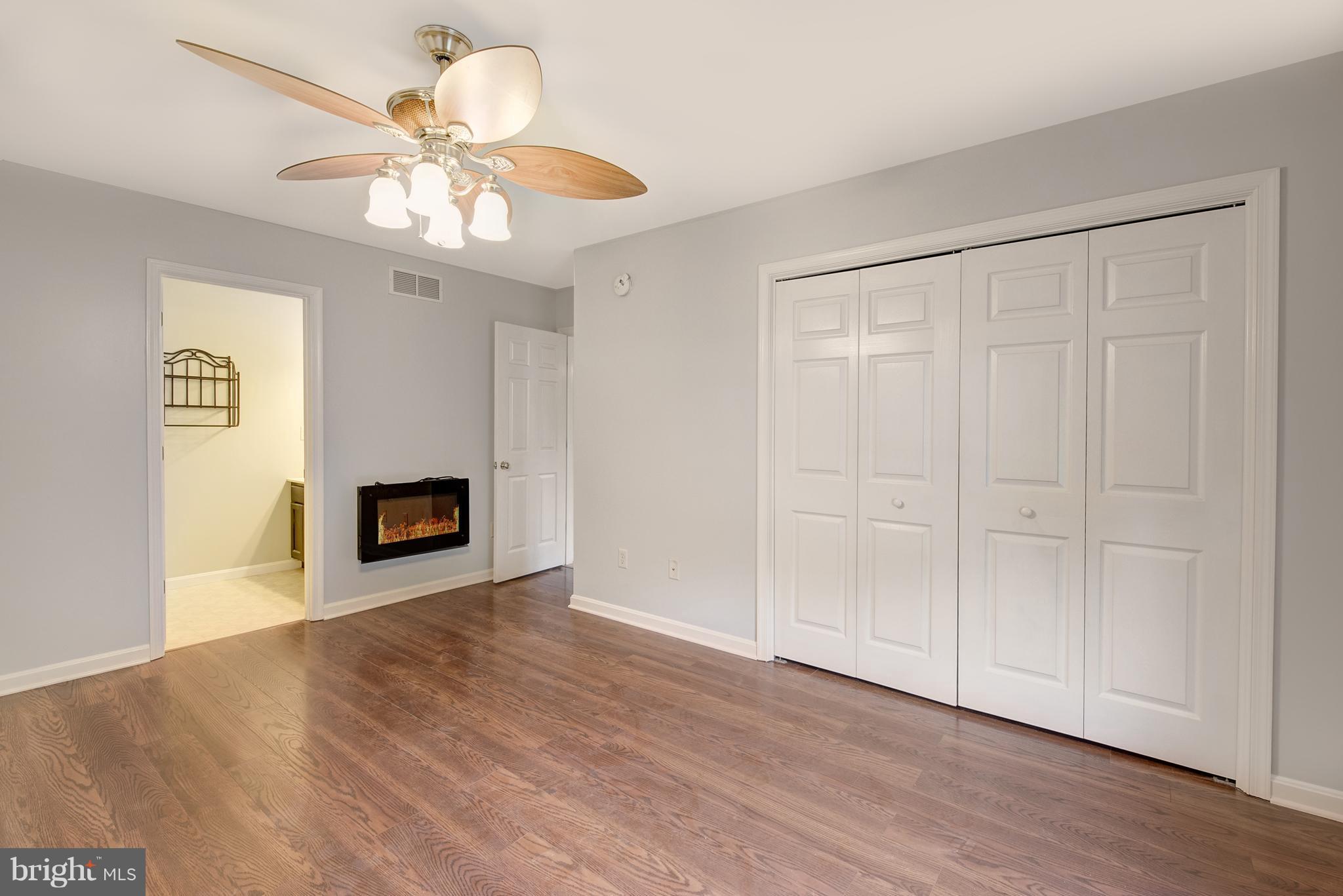 22943 Bay Shore Road Chestertown, MD 21620 - Photo 6 of 26 Master Bedroom With Propane Fire