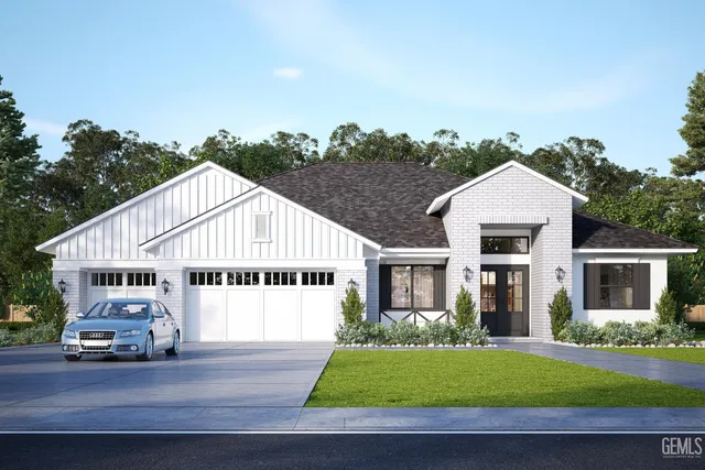 a view of a white house next to a yard with road and plants
