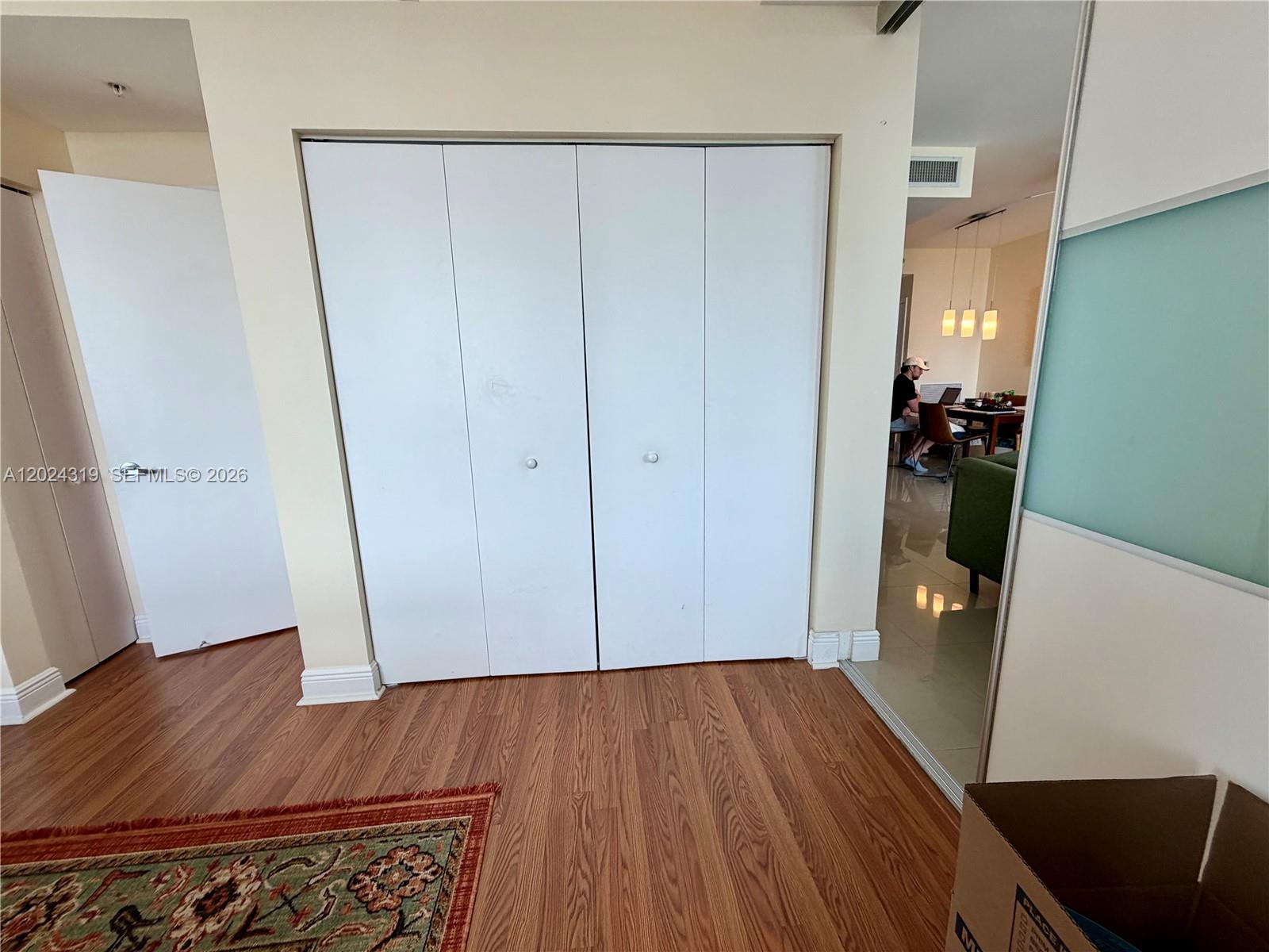 90 Southwest 3rd Street, Unit 1409 Miami, FL 33130 - Photo 11 of 25 wooden floor in an empty room